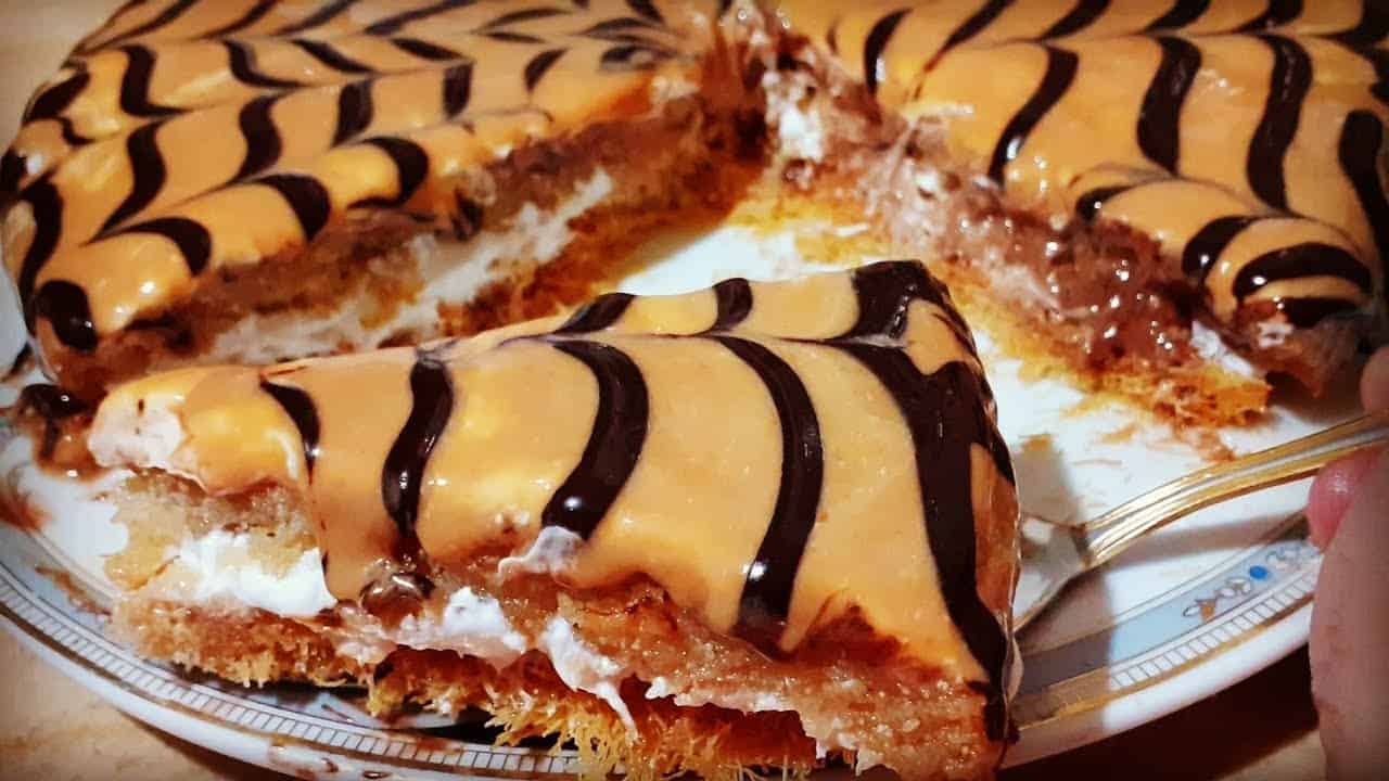 “حلوي السعادة واللذذة”..طريقة عمل المدلعة بكل أسرارها وتكاتها وبطعم لذيذ بالبسبوسة والكنافة والكراميل والكريمة خرافيء "حلوي السعادة واللذذة"..طريقة عمل المدلعة بكل أسرارها وتكاتها وبطعم لذيذ بالبسبوسة والكنافة والكراميل والكريمة خرافيء